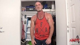 buff older guy shows hole in custodian closet